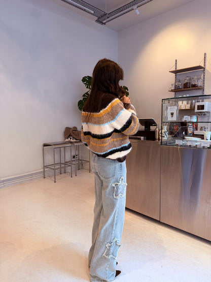 Asymmetriske stjernerjeans i lys denim